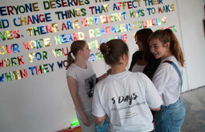 Colour to the Grey - Art, Activism and Wellbeing exhibition in Blyth, led by young people. Commissioned by Museums Northumberland bait. Photo: Jason Thompson Group of young people talking